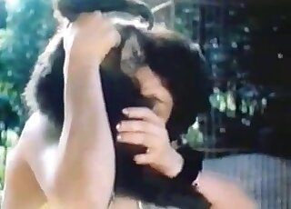 Dark-haired babe sucking a stiff monkey dick